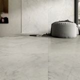 Gresie HBO 10 Invisible Gray Lucios 120x120 cm – ambient living, living cu pardoseala si perete marmura gri, pouf textil