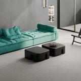 Gresie ABK Alterego Concrete Mat 60x60cm – ambient living, living modern cu canapea turcoaz si mese negre rotunjite, pe pardoseala