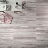 Gresie ABK Soleras Grigio Mat 20x120 cm – ambient living, pardoseala gri deschis efect lemn, masa alba, scaun rosu decorativ