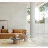 Gresie Ardesia Bianco Mat Anti-Slip 80x80 cm – ambient living, living modern cu canapea portocalie si perete gresie