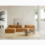 Gresie Ardesia Bianco Mat 60x120 cm – ambient living, living modern cu canapea portocalie si perete gresie marmorata