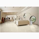 Gresie Concrete White Mat 60x120x0.6 cm – ambient comercial, showroom spatios cu canapele albe si ferestre rotunde, pe pardoseala
