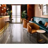 Gresie New Deco Grey Mat 60x60 cm – ambient comercial, lounge elegant cu bar auriu si canapea verde, pe pardoseala