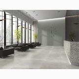Gresie Efect Beton Essence Materia Urban Mat 90x90 cm – ambient recepție și zonă lounge