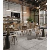 Gresie Form Story Grey 90x90 cm – ambient comercial, cafenea industriala cu pardoseala gri, mese si scaune lemn