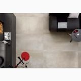 Gresie de exterior Metaline Plate Antislip Mat 60x60x2 cm – ambient living, vedere de sus living cu canapea neagra si accesorii rosii, pe pardoseala