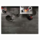 Gresie Metaline Iron Mat 120x120 cm – ambient living, vedere de sus, masa, scaune negre, pardoseala gri antracit
