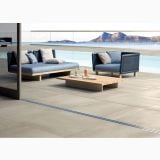 Gresie de exterior Metaline Plate Antislip Mat 60x60x2 cm – ambient terasa, terasa cu piscina, canapele albastre si vedere la mare, pe pardoseala