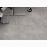 Gresie Portelanata iTiles StoneForm Grigio 80x80 cm – ambient living, pardoseala gri privita de sus cu canapea si pernute