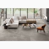 Gresie Shale Greige Mat 80x80 cm – ambient living, living modern cu canapea alba si scaun portocaliu, pe pardoseala